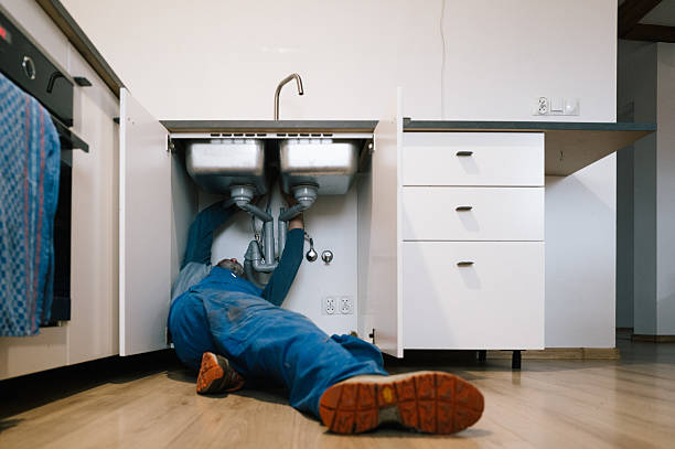 Professional Emergency Plumber technician working in Normal, IL